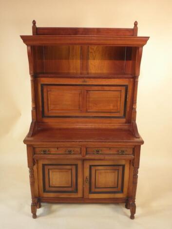 A late Victorian walnut aesthetic movement escritoire in the manner of Lamb of Manchester