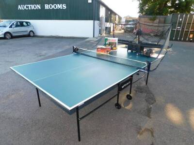 A Butterfly table tennis table, together with a net, balls, Newgy Pong-Master electronic table tennis game and a Robo Pong table tennis robot. (a quantity) Viewing and Collection from The Bourne Auction Rooms