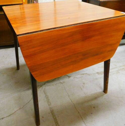 A vintage drop leaf table, on tapering splayed legs when closed, 74cm high, 77cm wide, 70cm deep.