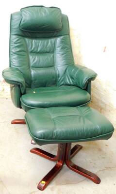 A swivel office chair in green leatherette, 102cm high, with footstool.