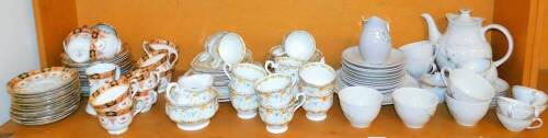 A Royal Albert Gaiety pattern part tea service, to include sandwich plates, sugar bowl, 12cm wide, milk jug, cups, saucers, etc., a Royal Doulton frost pine part service and another Royal Albert Lovian part service. (1 shelf)