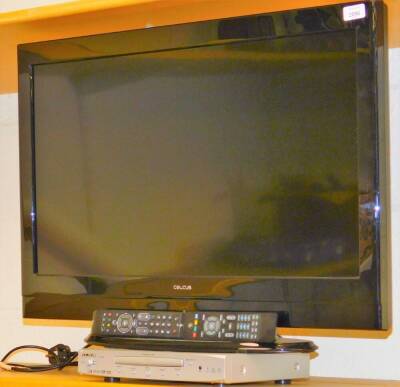 A Celcus 21 inch colour television in black, 32882HDLCD, with a Alba DVD player, with associated remote controls and wires.