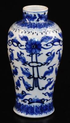 A Chinese blue and white porcelain baluster vase, decorated with four clawed dragons chasing the flaming pearl among clouds, the base bearing a four character Kangxi mark, probably 19thC, 17.5cm high.