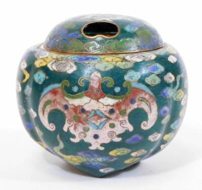 A Japanese green ground cloisonne tripod koro and pierced cover, decorated with stylized bats on a cloud background, the base marked Great Ming, 9cm diameter.
