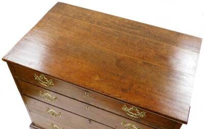 An 18thC oak chest, of four long graduated drawers, each with plate back swan neck handles, on ogee bracket feet, 75cm high, 86cm wide, 53cm deep. - 2