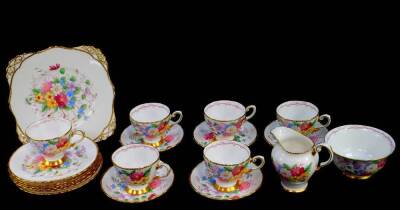 A Tuscan porcelain part tea sevice, decorated with sprays of flowers, printed mark, comprising bread plate, cream jug, sugar bowl, six tea cups, five saucers, and six tea plates.