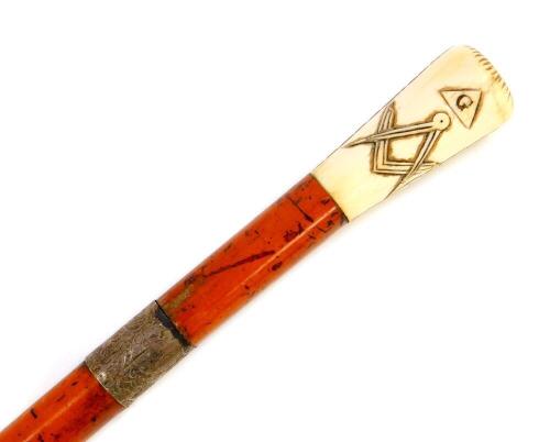 A Victorian Masonic malacca sword stick, with ivory handle, carved with the all seeing eye, dove, set square and compass, with silver ferrule, Birmingham 1884, stick 87cm high, blade 65cm wide.