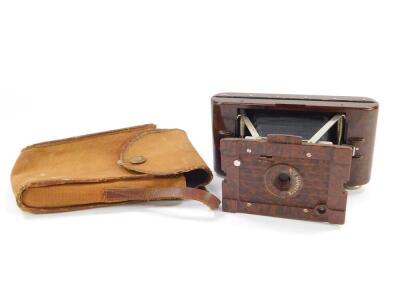 A Kodak Hawkette No 2 brown Bakelite cased camera, in a canvas outer case.