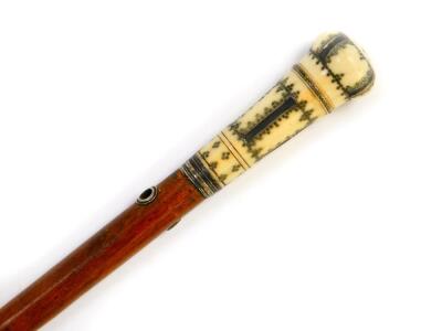 A Georgian malacca lady's pomander cane, the ivory handle with silver pique decoration, unscrewing to reveal the pomander, 91.5cm high.