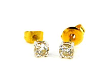 A pair of 18ct white gold and diamond solitaire earrings, approximately 0.5cts, 0.9g.