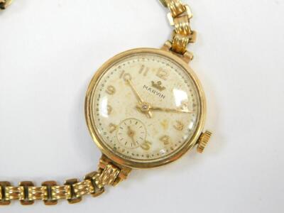 A Marvin lady's 9ct gold circular cased wristwatch, white dial bearing Arabic numerals, subsidiary seconds dial, on a 9ct gold bracelet strap, 16.3g all in. - 2