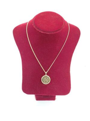 A 9ct gold circular double photo locket, foliate engraved, on a curb link neck chain, 8.8g all in.