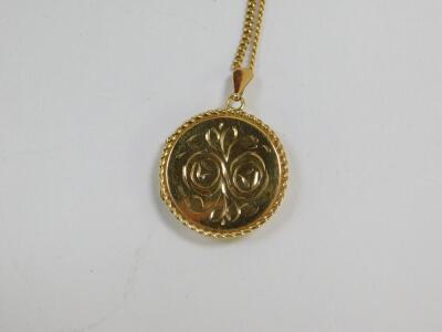 A 9ct gold circular double photo locket, foliate engraved, on a curb link neck chain, 8.8g all in. - 2