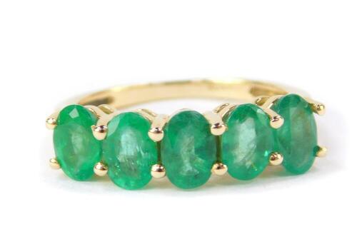 A 9ct gold and Zambion emerald five stone ring, 2.16cts, size L/M, 2.2g gold, with certificate.