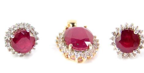 A 9ct gold Madagascar ruby and zircon pendant, ruby 8.05cts, 1.81g gold, and a pair of silver Madagascan ruby and white topaz earrings, rubies approx 5cts, with certificate.