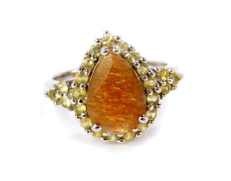 A Silver Shinyanga sunstone and yellow sapphire ring, in a pear shaped design, sunstone 2.62cts, size N/O, with certificate.