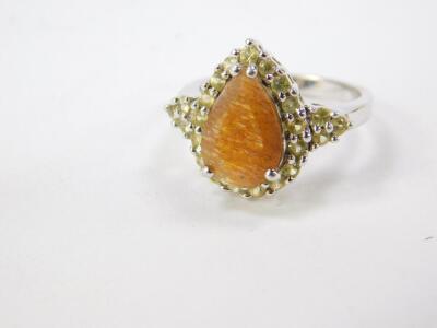 A Silver Shinyanga sunstone and yellow sapphire ring, in a pear shaped design, sunstone 2.62cts, size N/O, with certificate. - 2