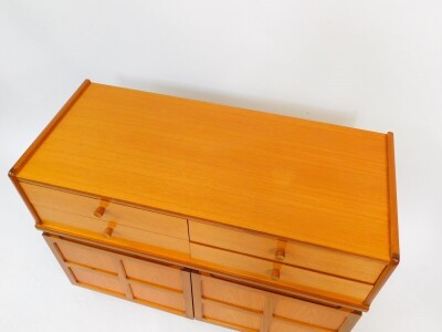 A Nathan teak cupboard chest, of four drawers over a pair of cupboard doors, raised on a plinth base, 75cm high, 102cm wide, 44.5cm deep. - 2