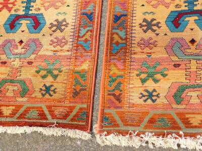 A pair of Egyptian Gabbeh Rug Collection rugs, decorated with nomadic tarantula type motifs and flowers, against a fair coloured ground, in a varied coloured border, 140cm x 80cm. (2) - 2