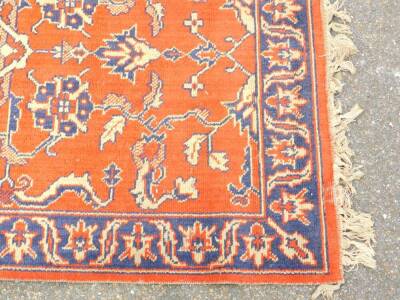 A Caucasian red ground rug, decorated with floral and foliate motifs, 170cm x 88cm. - 2