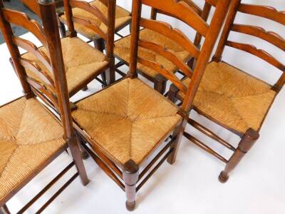 A set of six 19thC oak single ladderback dining chairs, with rush seats, raised on turned legs, united by stretchers. - 2