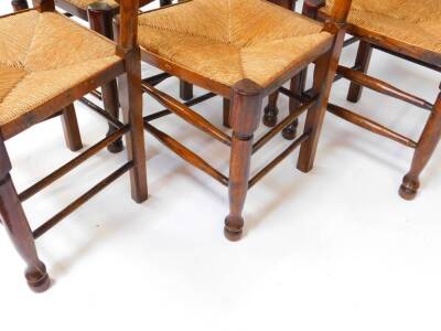 A set of six 19thC oak single ladderback dining chairs, with rush seats, raised on turned legs, united by stretchers. - 3