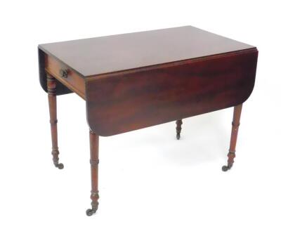 A George IV mahogany Pembroke table, with single frieze drawer raised on turned legs, brass capped on castors, 58cm wide, 111cm extended, 96.5cm deep, 73cm high.