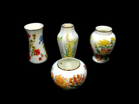 Four Wedgwood porcelain seasonal floral vases, commissioned by the Royal Horticultural Society 1979-81, comprising The Summer Rose, The Autumn Chrysanthemum, The Winter Bouquet, and The Spring Time vase, three with certificates.