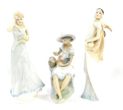 A Royal Doulton figure modelled as Charisma, Reflections Series HN3090, another modelled as Windflower HN3077, and a Nao porcelain figure modelled as a seated girl with a cockerel. (3)