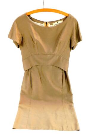 A Jacques Hyme 1950's pale brown taffeta dress, with loose draped top and white silk under section, rear bow adornment, size 15, bears label.