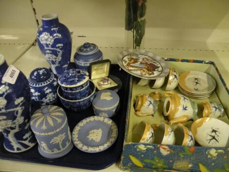 A pair of Chinese blue and white vases decorated with prunus