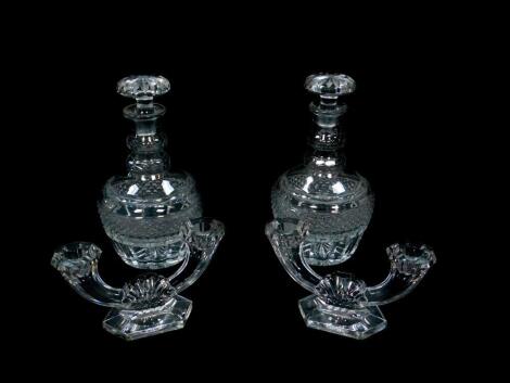 A pair of cut glass decanters and stoppers, 25cm high, together with a pair of Val St Lambert twin branch candelabra, 20cm wide. (4)