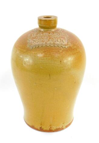 A Victorian stoneware flagon, 1 gallon, with moulded rectangular banner engraved 'I.Leake, Robin Hood Inn, Newark', 30cm high.