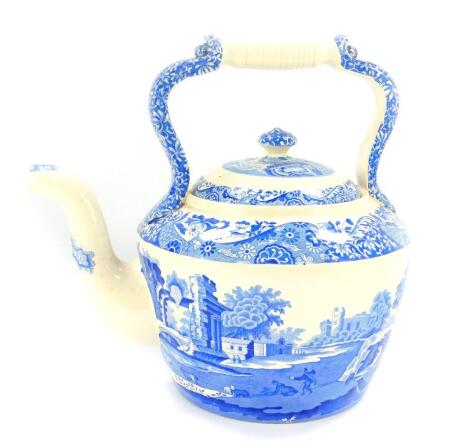 A Spode pottery kettle, transfer decorated in blue and white in the Italian pattern, 31cm wide.