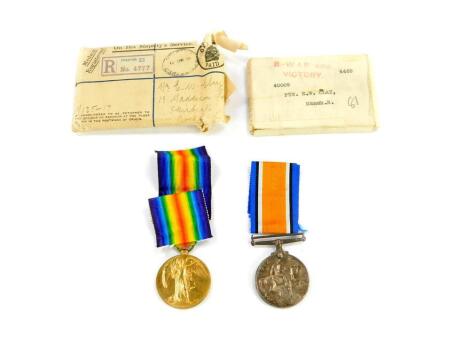 A pair of Great War medals, named to Pte E W Clay, Manchester Regiment, 40009, comprising Great War and Victory medals, parcel named to him at 13 Maddison Row, Skirbeck, Boston.