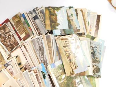 Edwardian and later topographical postcards and greetings cards, together with a Victorian scrap book. (quantity) - 4