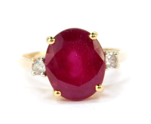 A 9ct gold Madagascan ruby and zircon ring, the oval cut ruby 6.35cts, size N/O, 2.24g gold, with certificate.