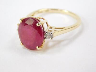 A 9ct gold Madagascan ruby and zircon ring, the oval cut ruby 6.35cts, size N/O, 2.24g gold, with certificate. - 2