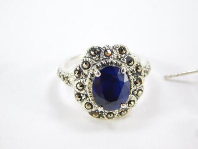 A silver sapphire and marcasite ring, 29.5cts, size N/O, together with a sapphire and marcasite pendant and pair of earrings, with certificates. - 2