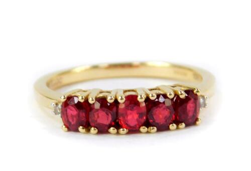 A 9ct gold and red spinel five stone ring, 1.12cts, size N/O, 2.03g gold, with certificate.