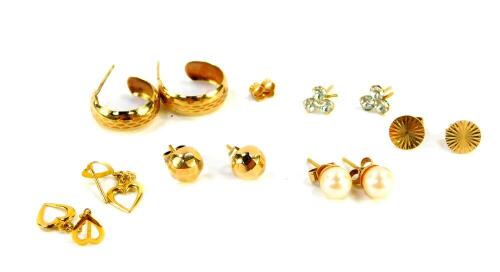 A pair of 9ct gold and cultured pearl earrings, a pair of 9ct gold hoop earrings, and four further pairs of 9ct gold earrings, 6.4g all in.