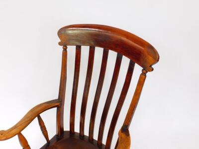 A Victorian oak and elm lath back kitchen chair, raised on turned legs united by an H frame stretcher. - 2