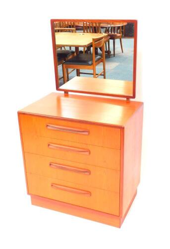 A G-Plan teak lady's dressing chest, with a swing frame mirrored back, over four graduated drawers raised on a plinth base, 125.5cm high, 71cm wide, 44.5cm deep.