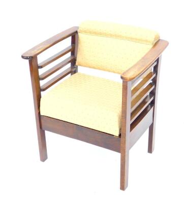 A Utico oak music chair, with sliding overstuffed seat and back.