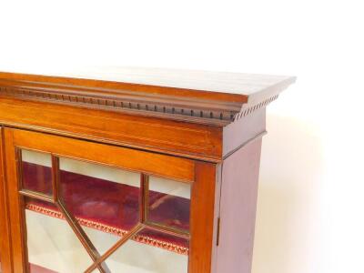 A Georgian and later mahogany display cabinet, the outswept pediment with dentil moulding, two glazed doors opening to reveal three velvet lined shelves, on a later base raised on cabriole legs, 139cm high, 110cm wide, 29.5cm deep. - 2