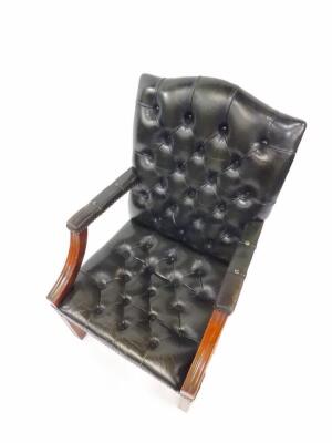 A Georgian style mahogany and green leather open armchair, with button back, over stuffed seat and arm rests, raised on square fluted legs, united by an H frame stretcher. - 2