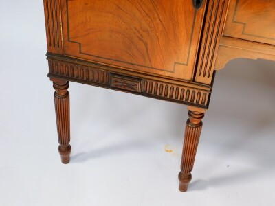 A George IV mahogany and ebony line inlaid sideboard, with splash back, two central drawers flanked by a pair of cupboard doors, raised on turned and fluted cylindrical legs, 112cm high, 151.5cm wide, 54cm deep. - 2