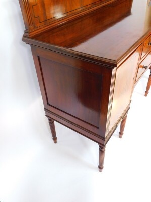 A George IV mahogany and ebony line inlaid sideboard, with splash back, two central drawers flanked by a pair of cupboard doors, raised on turned and fluted cylindrical legs, 112cm high, 151.5cm wide, 54cm deep. - 5