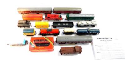 A OO gauge diesel locomotive M79079, three Tri-ang coaches, wagons and a Lima LMS tank engine 8920. (quantity)