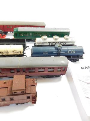 A OO gauge diesel locomotive M79079, three Tri-ang coaches, wagons and a Lima LMS tank engine 8920. (quantity) - 4